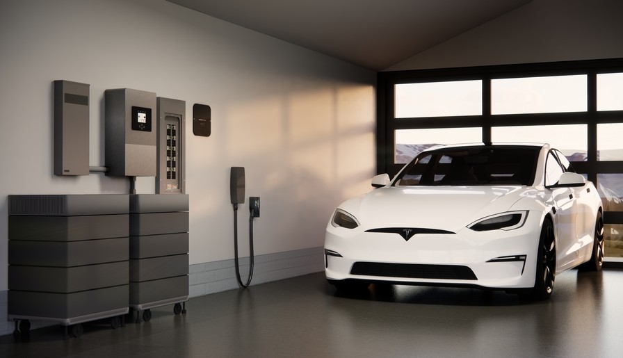 Savant Power system in a garage with a white Tesla car.